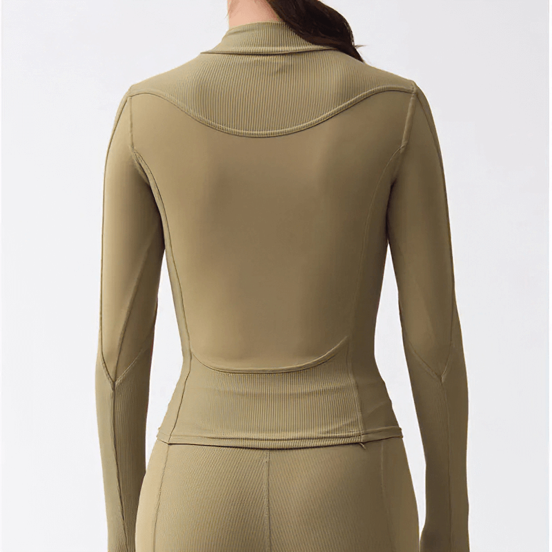 Back view of Women's Long-Sleeved Solid Top with Half Zipper, breathable and water-resistant nylon, perfect for colder weather.